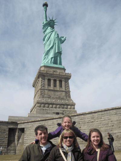 new york city-family at statue of liberty