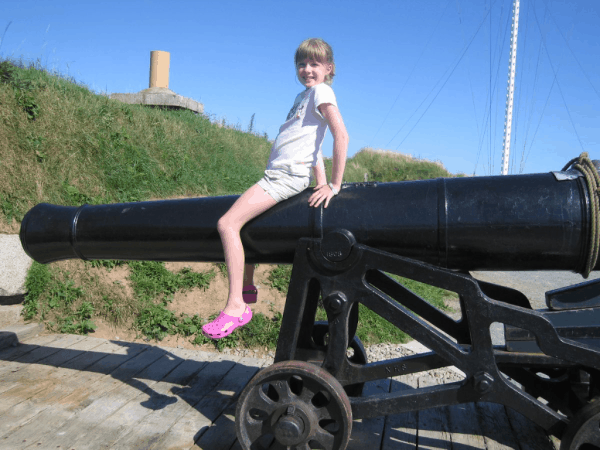 nova scotia-halifax-citadel-girl on cannon