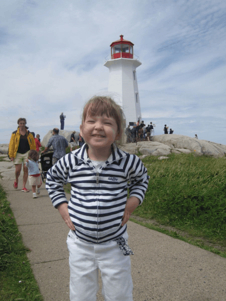 nova scotia-peggy's cove-young girl at lighthouse