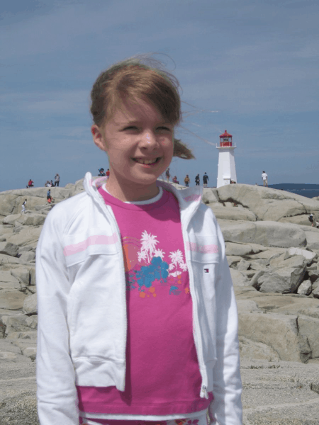 nova scotia-peggy's cove-girl at lighthouse