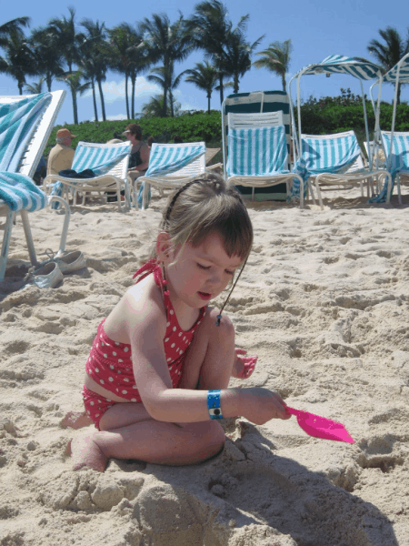 bahamas-atlantis-playing in sand on beach