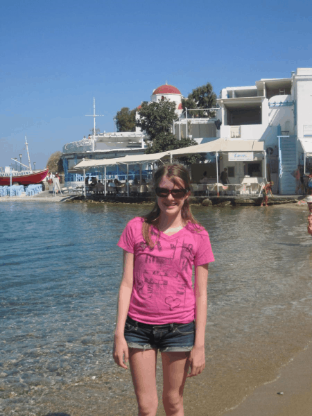 Greece-young girl on beach in Mykonos