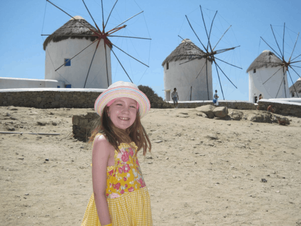 young girl-windmills-Mykonos-greece