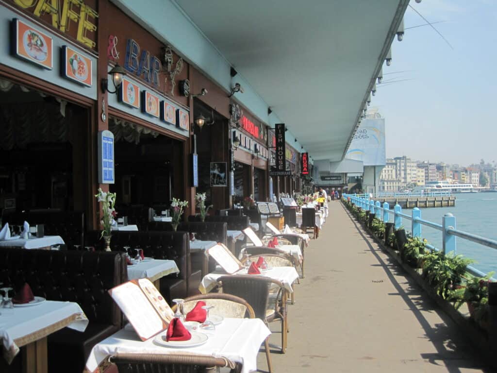 Restaurants along the Bosphorus with tables set for outdoor dining - Istanbul.
