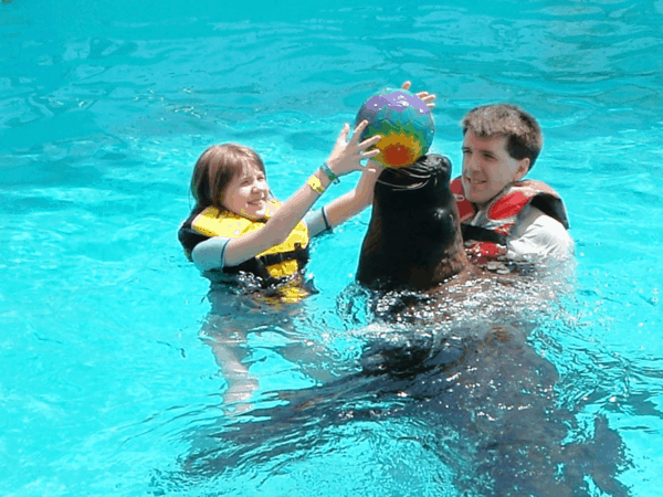 Playing ball with sea lions at Coral World, St. Thomas, USVI