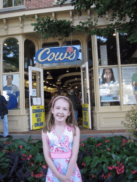 Emma outside COWS Ice Cream in Niagara-on-the-Lake