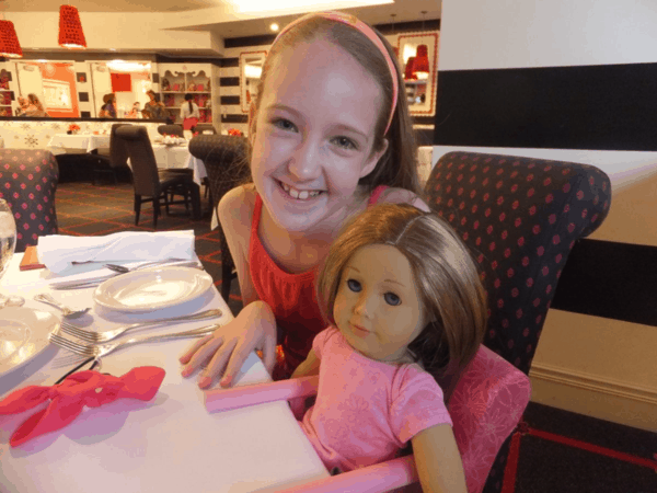 American Girl Cafe Chicago-girl dining with doll