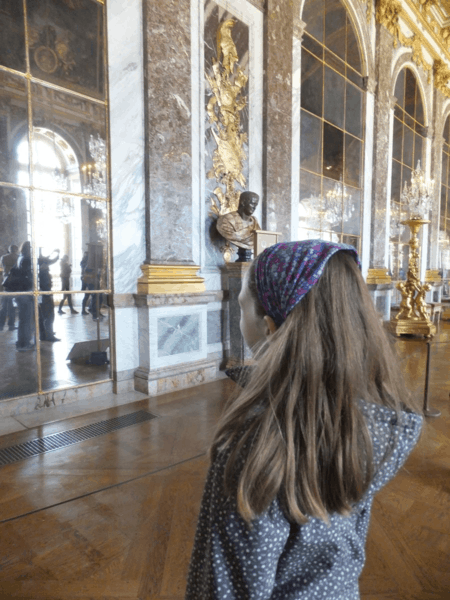 Young girl in the Hall of Mirrors at Chateau de Versailles