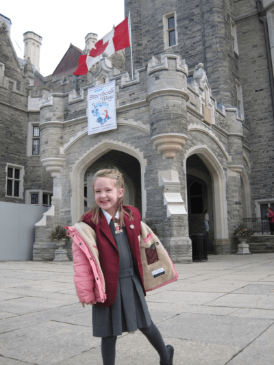 Emma outide Casa Loma on a class trip