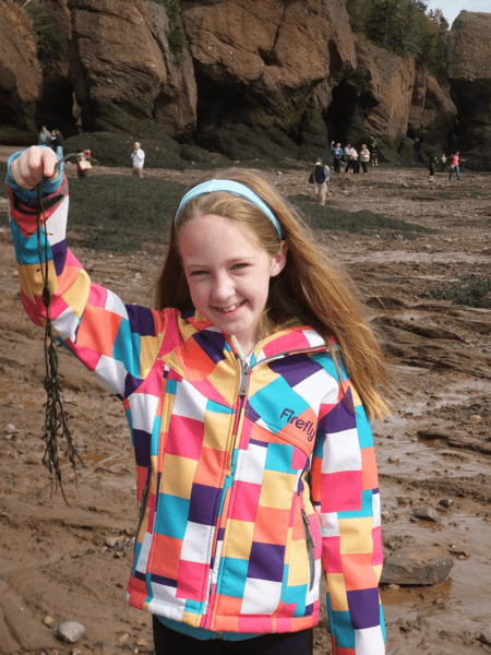 Playing with seaweed at Hopewell Rocks