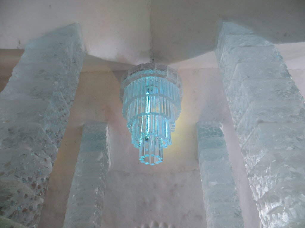 ice chandelier hanging from ceiling in ice hotel quebec.