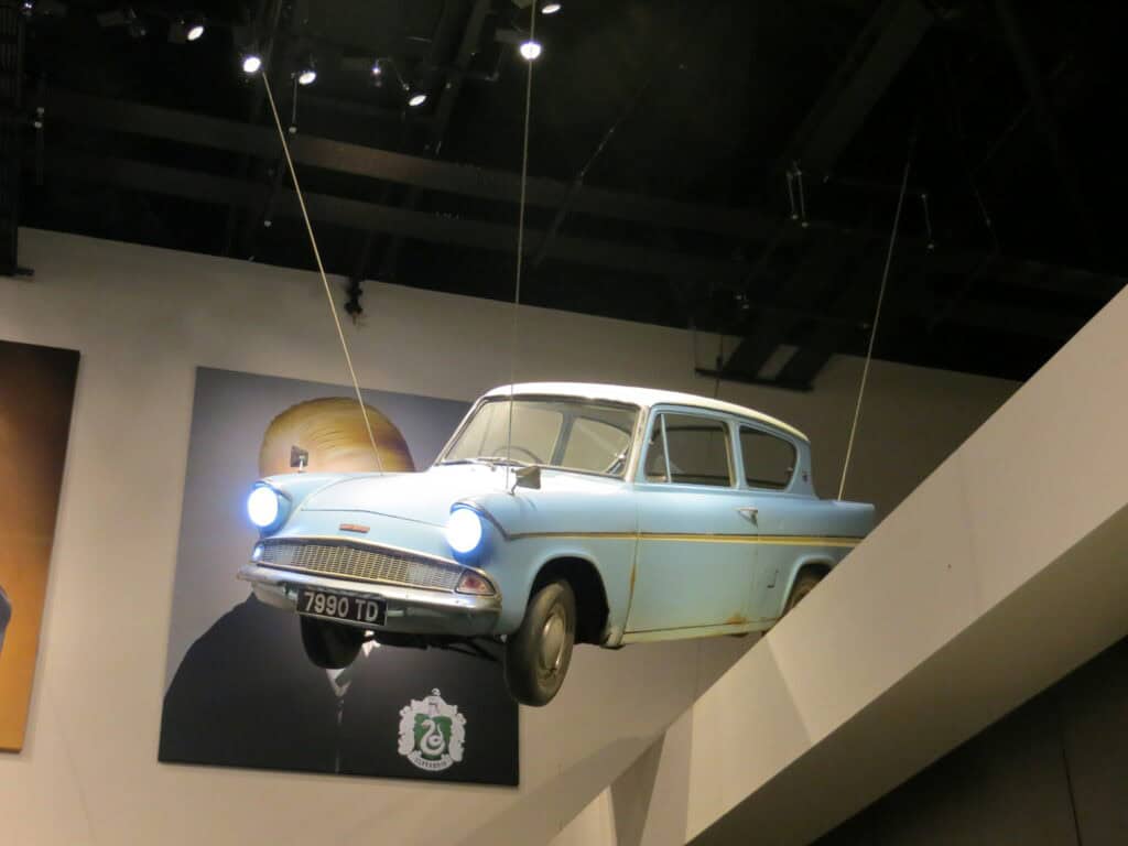 blue car suspended from ceiling at warner bros. studio tour the making of harry potter.
