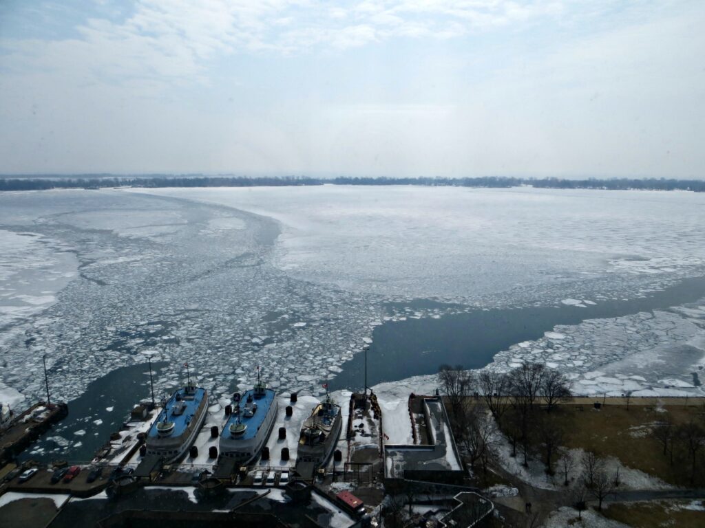 view of toronto harbour in winter with ice from westin harbour castle.