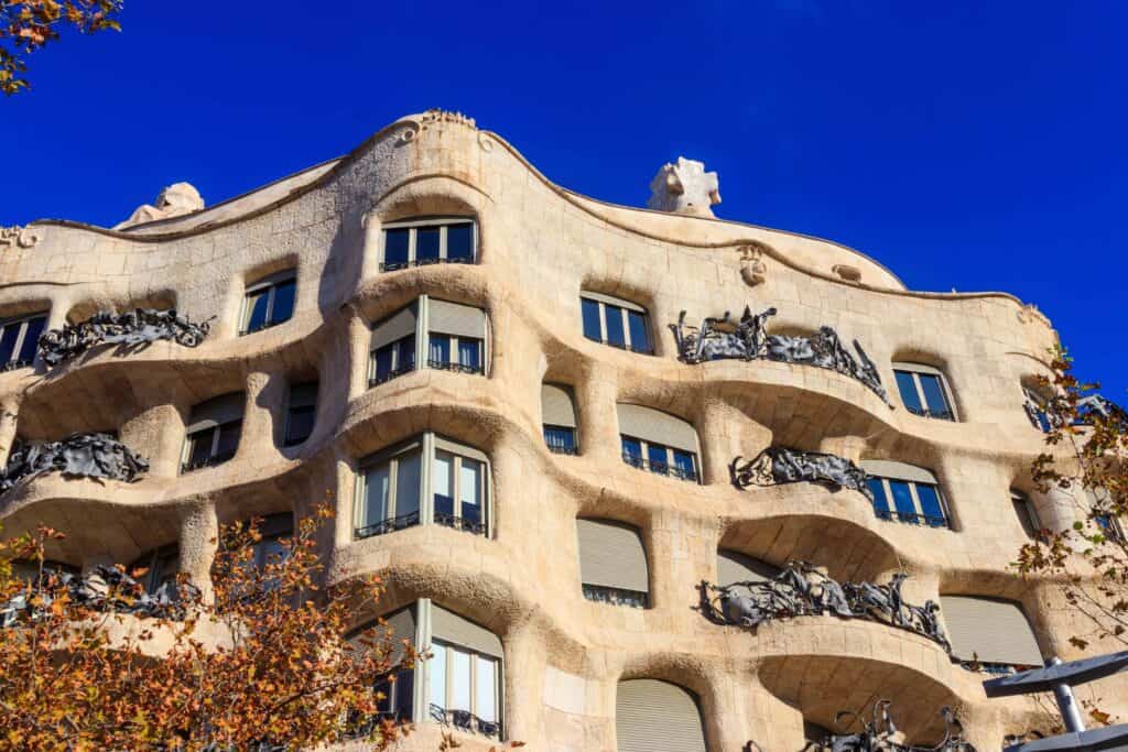 exteriior of casa mila in Barcelona with dark blue sky.