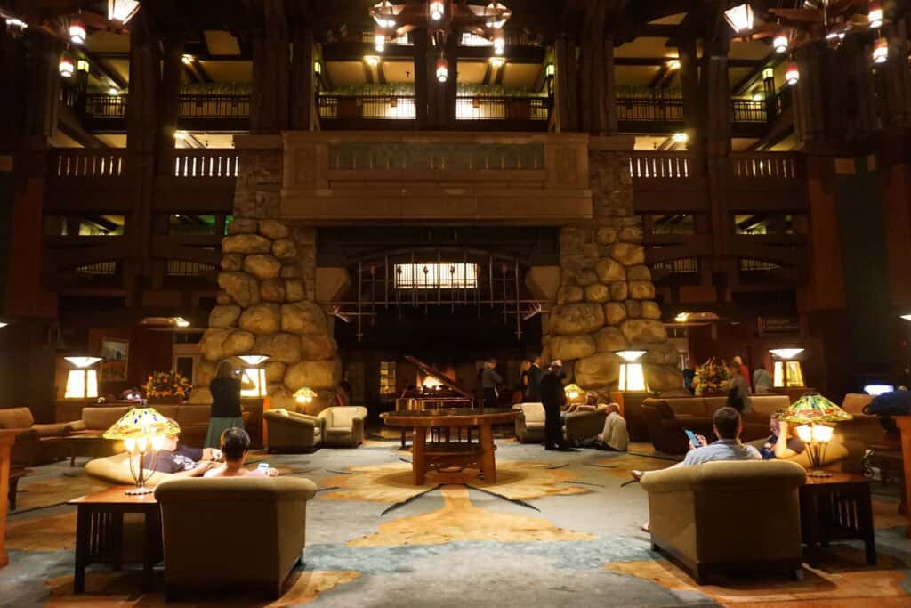 large stone fireplace and seating area in the lobby of the Grand Californian Hotel at Disneyland.