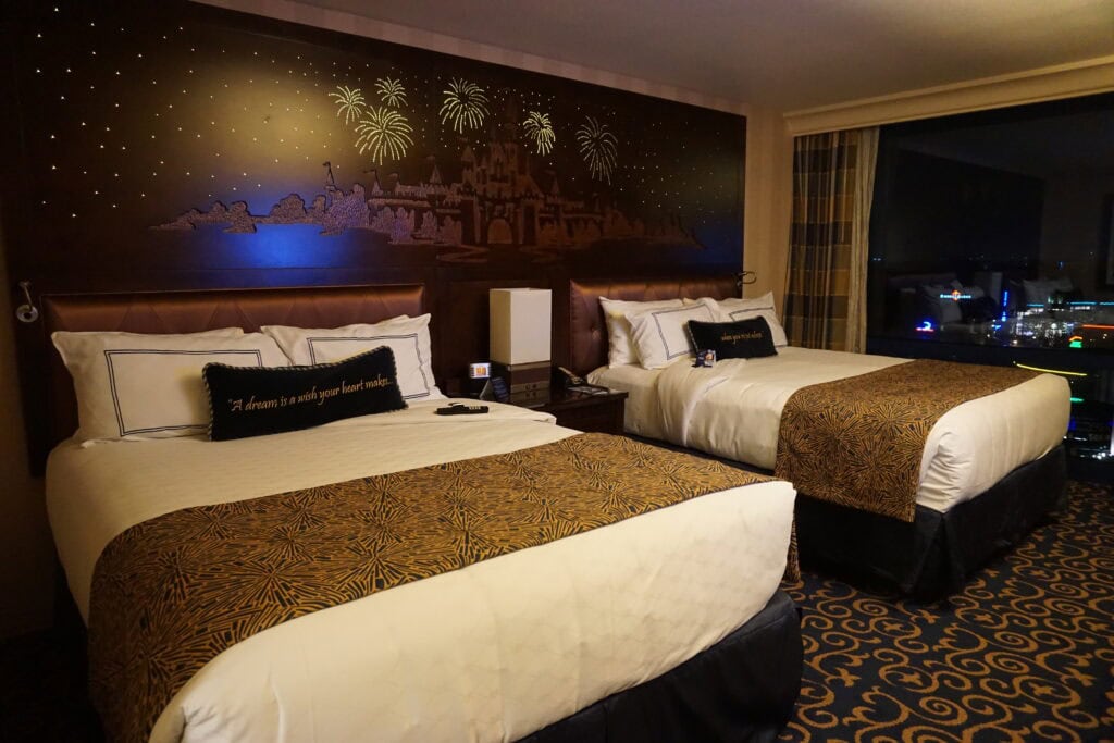 two beds with headboard lit up like fireworks over disneyland.
