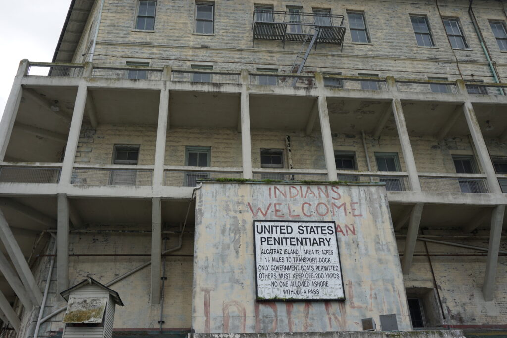 building at entrance to Alcatraz with Indians Welcome sign