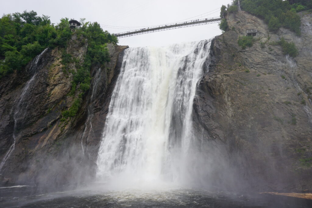 Montmorency Falls and suspension bridge viewed from base of the falls.