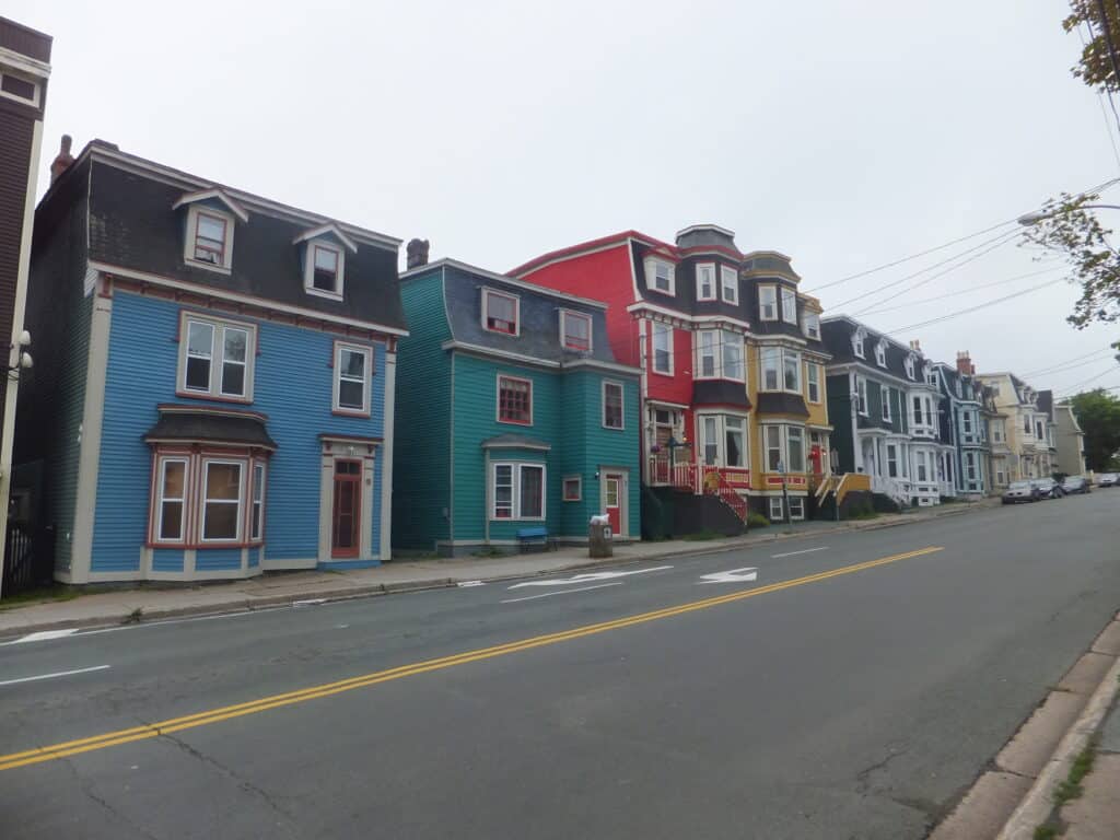 row of colourful "jelly bean row" houses in St. John's, Newfoundland on an overcast day.