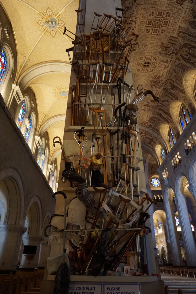 Crutches of the Cured - pillar with crutches displayed up to the ceiling in the basilica of Sainte-Anne-de-Beaupre.