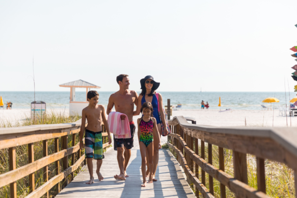 Florida-Fort Myers-Pink Shell Beach Resort-Family Walking In From Beach