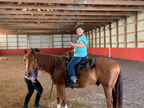 Newport Equestrian Academy-Newport RI-boy on horse in stable