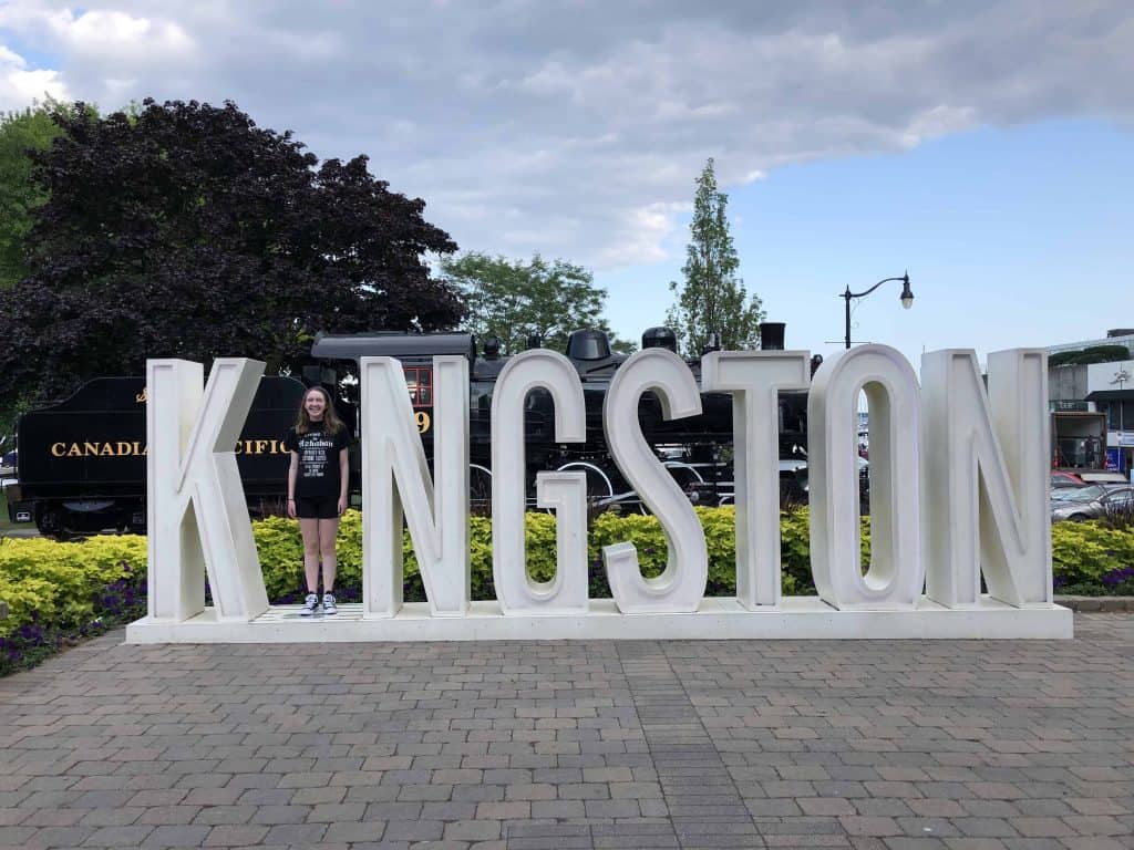 teenage girl with Kingston sign