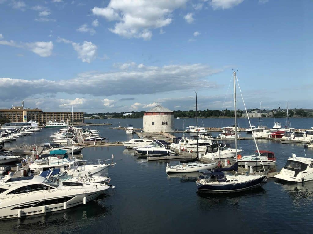 view of kingston waterfront with boats and martello tower