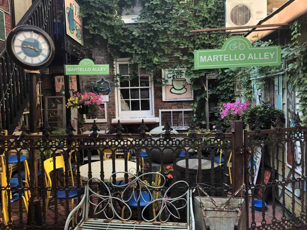 Tea room in Martello Alley, Kingston, Ontario with table and chairs and large old-fashioned clock