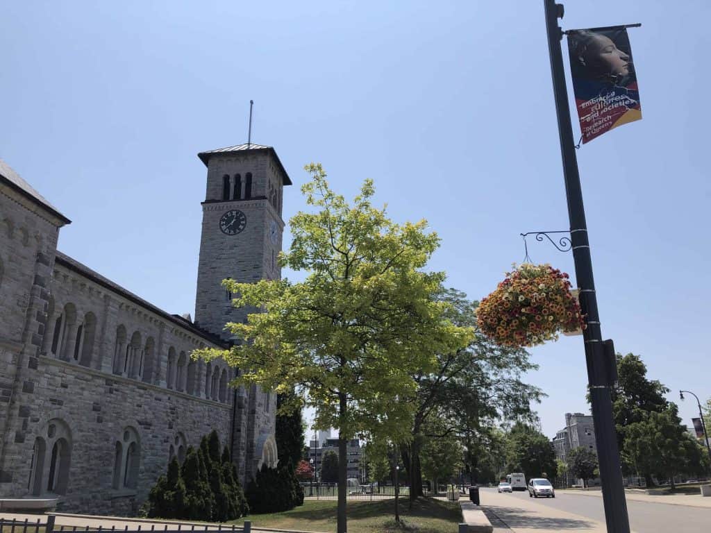 grant hall limestone clock tower on queen's university campus in Kingston, Ontario