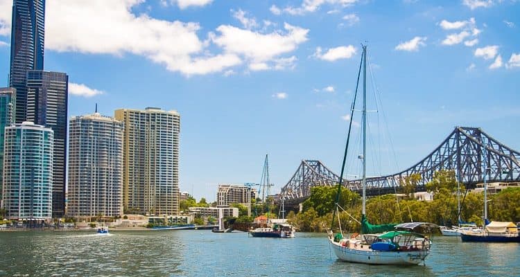 boats in city harbour with bridge