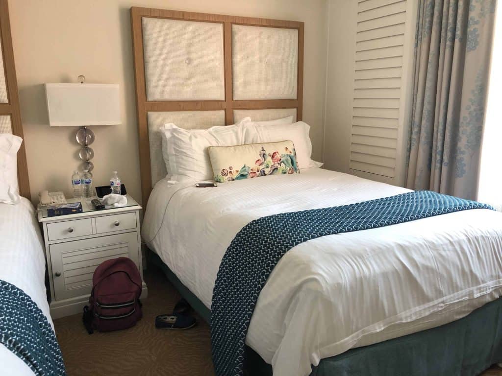 bed and night table in hotel room at Don CeSar Hotel -