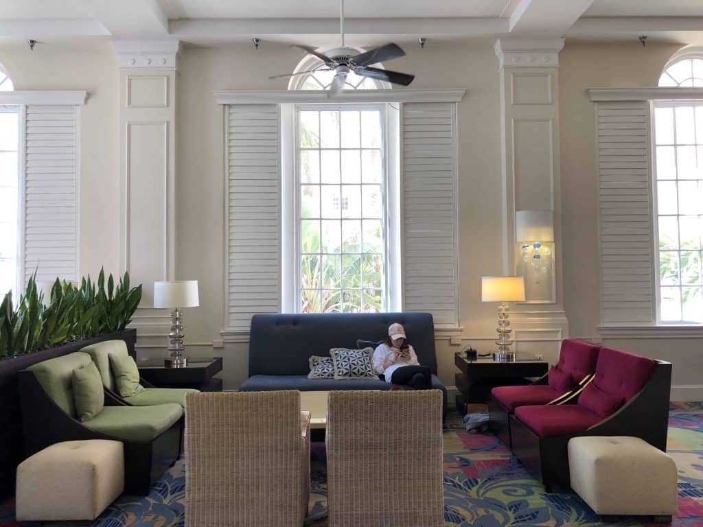 young woman sitting in resort lobby