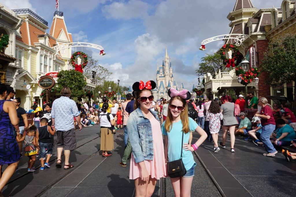 girls on main street usa disney world at christmas