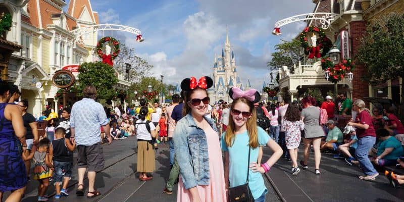 girls on main street usa disney world at christmas