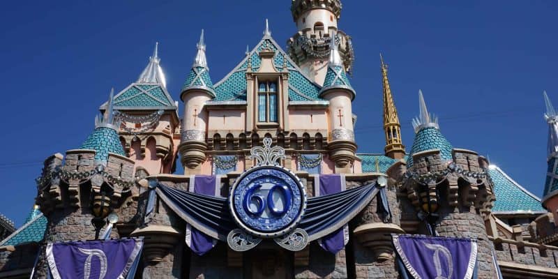 Sleeping Beauty Castle at Disneyland decorated for 60th anniversary celebrations