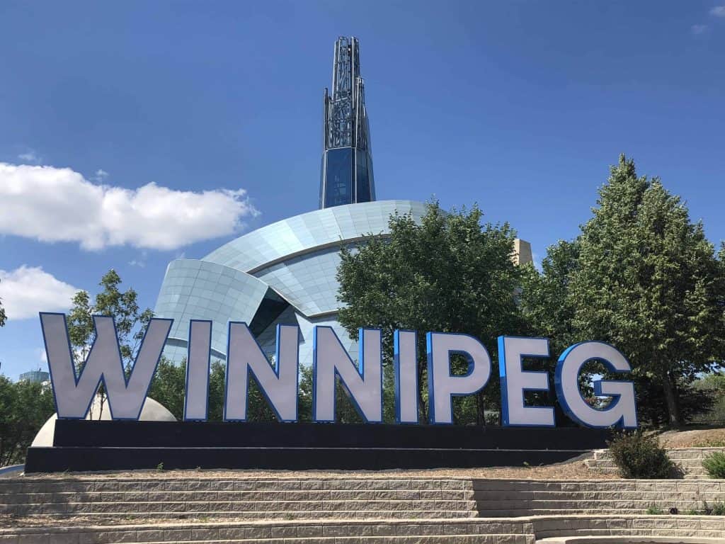 Winnipeg sign in front of Canadian Museum for Human Rights in Winnipeg, Manitoba.