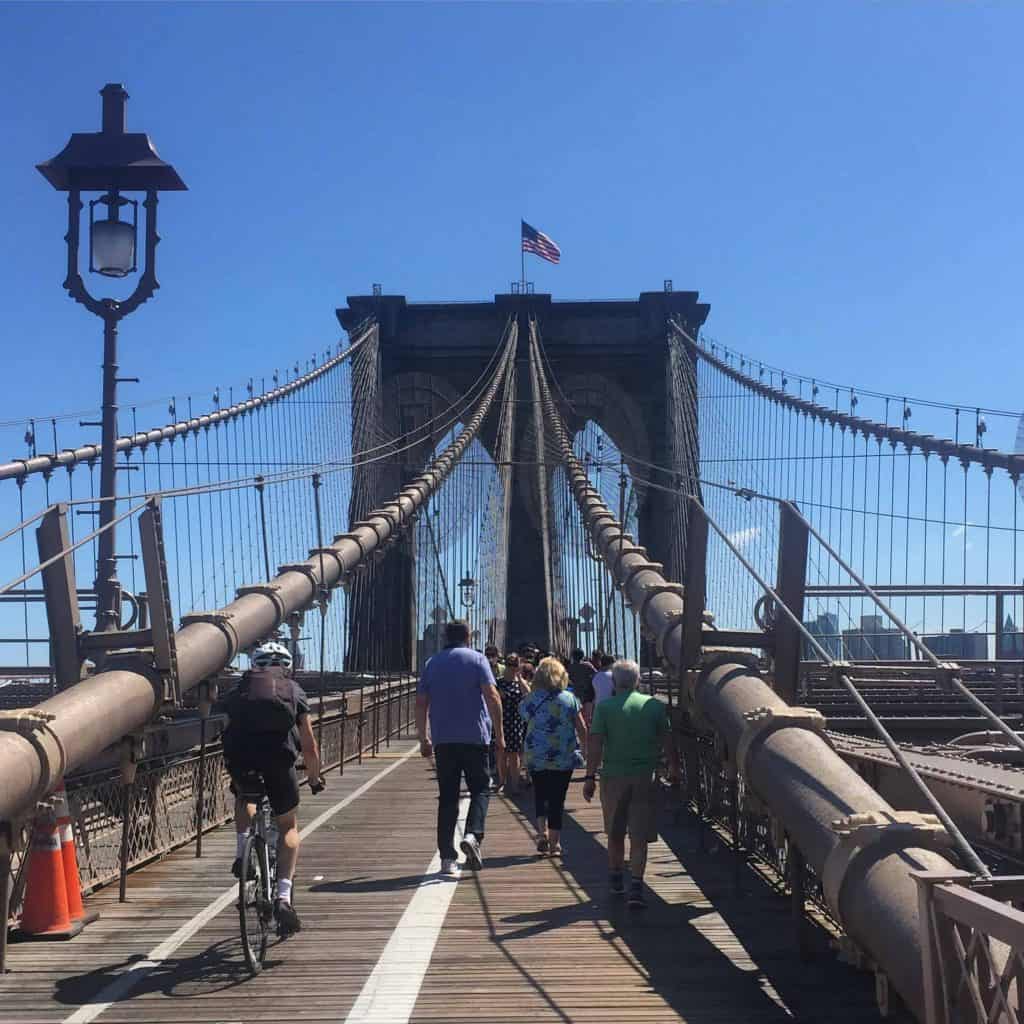 pedestrians and cyclists on brooklyn bridge