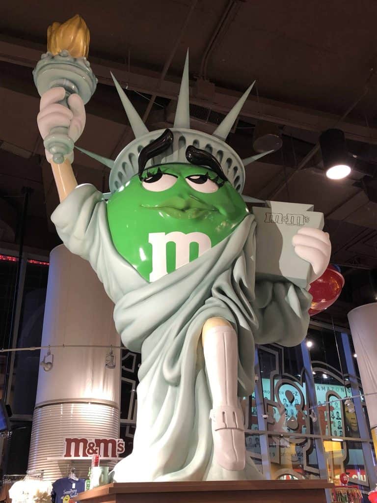 green m&m dressed as statue of liberty