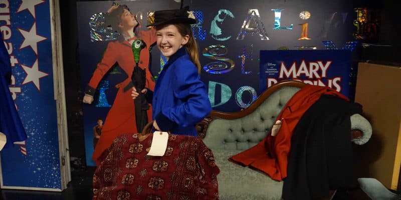 teen dressed as mary poppins with props from broadway musical