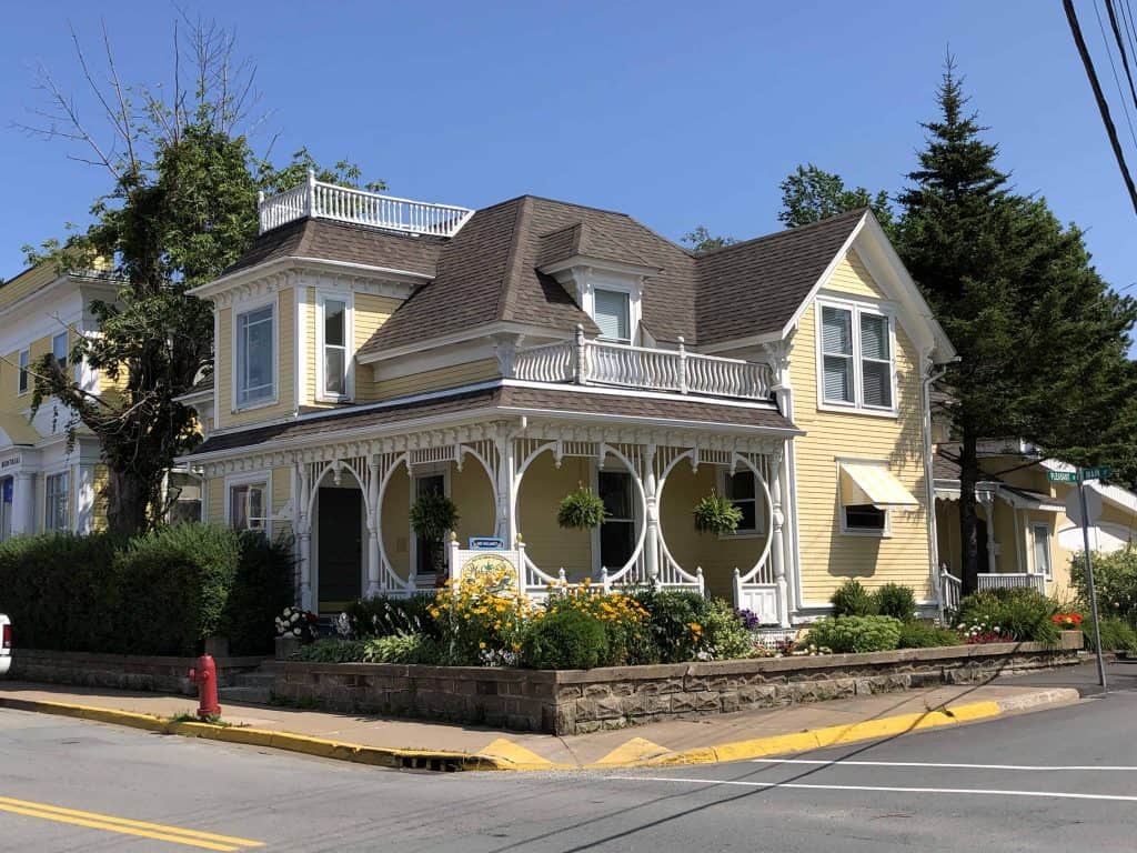 yellow building with porch on street corner