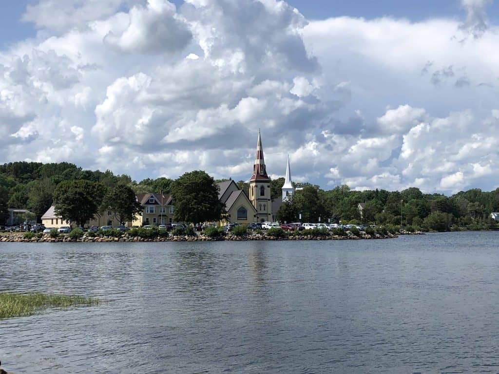 nova scotia lighthouse route-mahone bay-churches on waterfront with cars parked in front