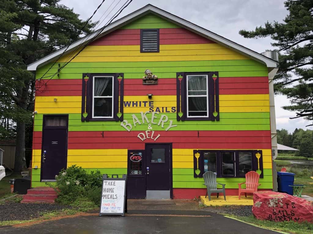 Striped green red and yellow white sails bakery & deli