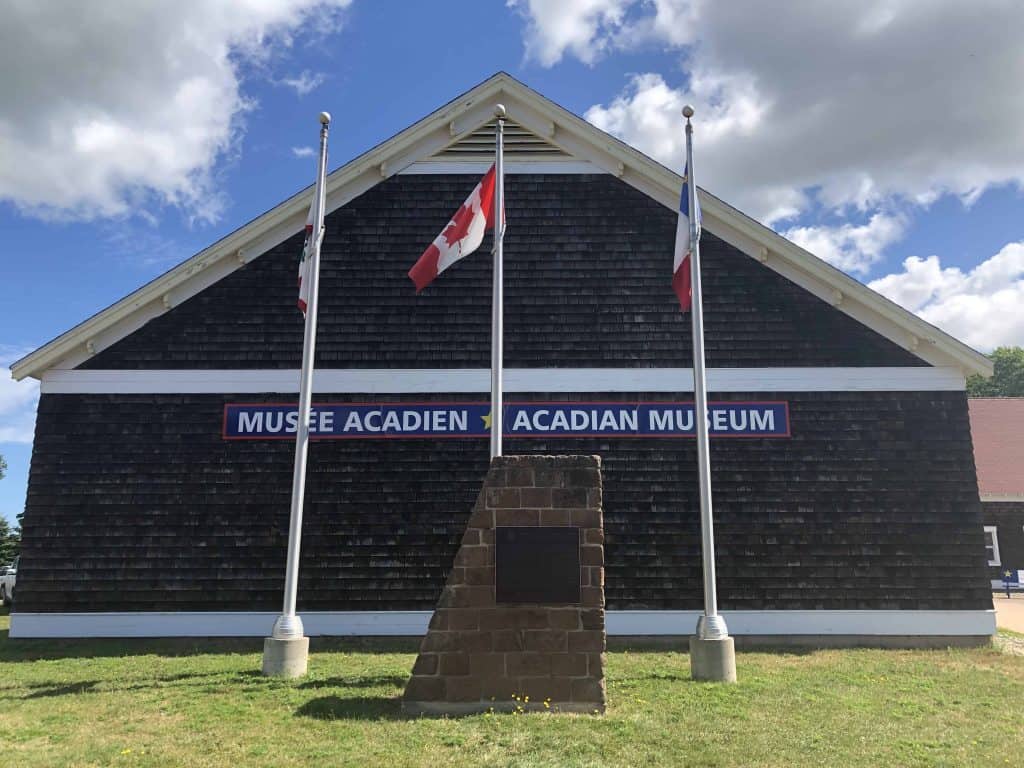 Acadian Museum with flags out front - prince edward island north cape coastal drive