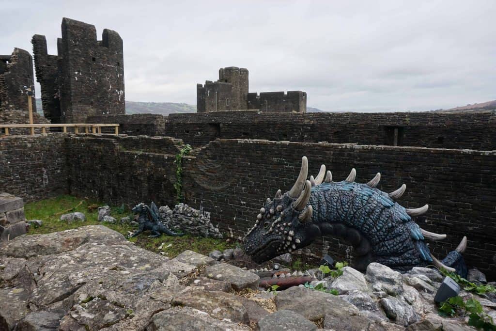 dragon sculpture at ancient stone castle