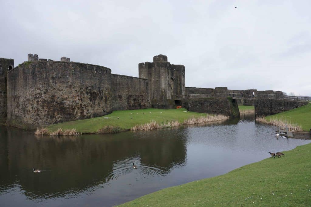 ancient stone castle exterior surrounded by water