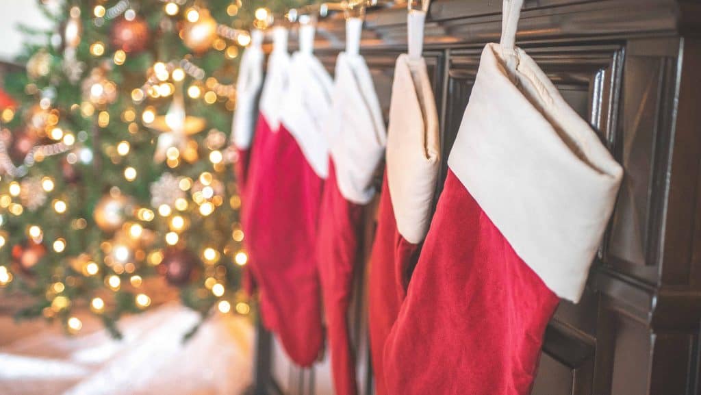 red and white christmas stockings hanging