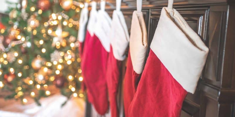 red and white christmas stockings hanging