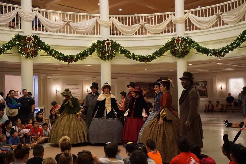 singers in victorian dress in rotunda of american adventure pavilion epcot