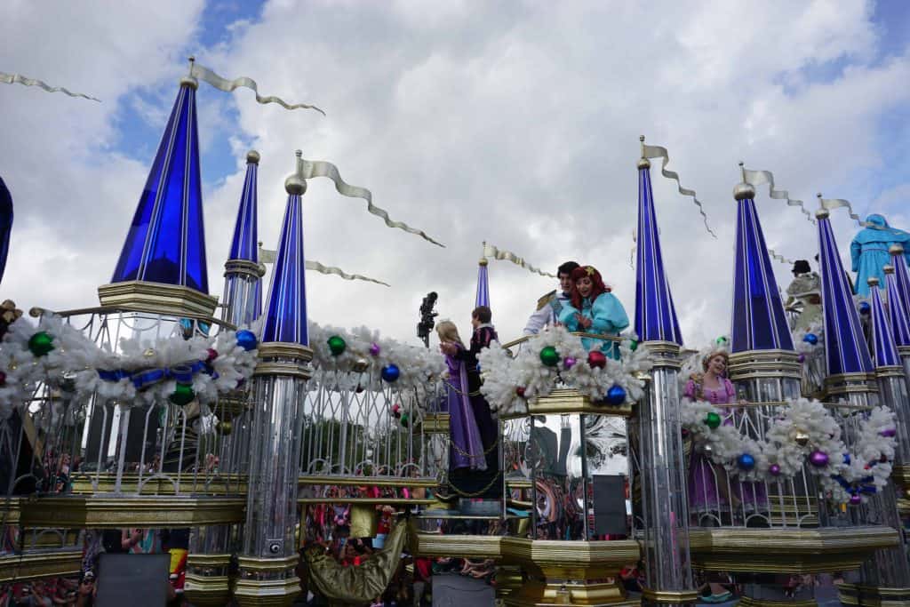 christmas float with princes and princesses at disney world